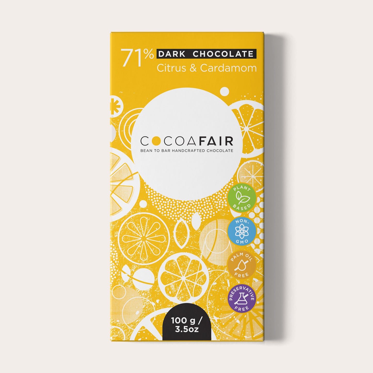 COCOAFAIR 100g 71% Dark Chocolate Packaging shot - Front view, Yellow packaging on white background. Citrus and Cardamom flavoured chocolate.